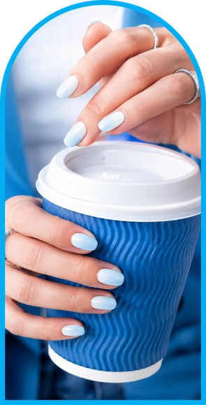 Elegant hands holding a coffee cup